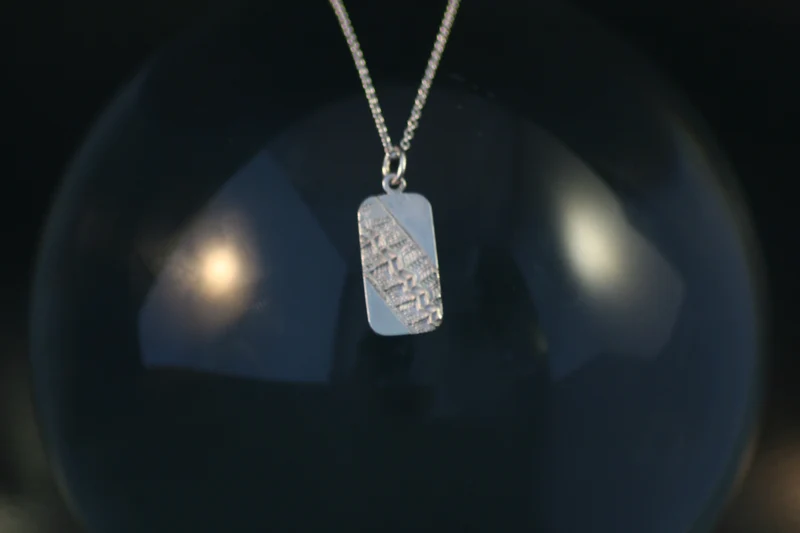 Tire imprint pendant