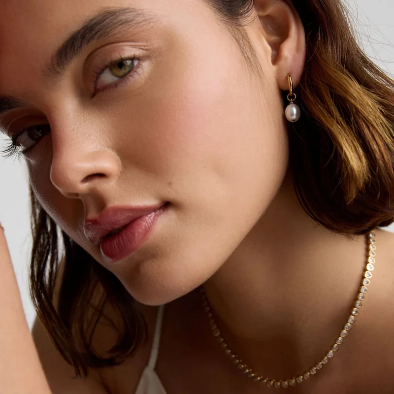 Gold Pearl Huggie Earrings
