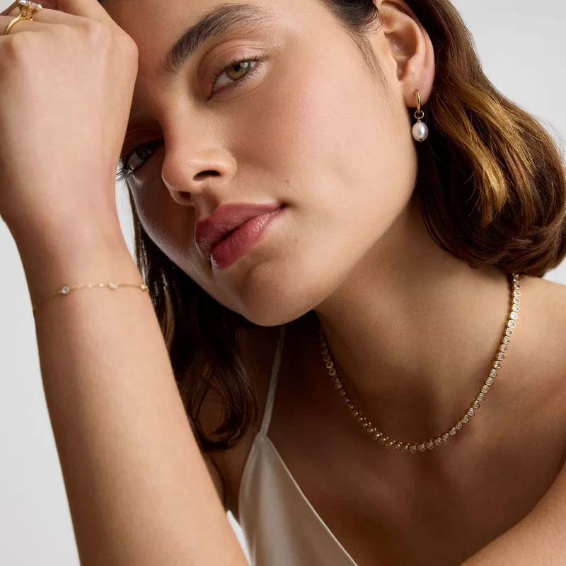 Gold Pearl Huggie Earrings