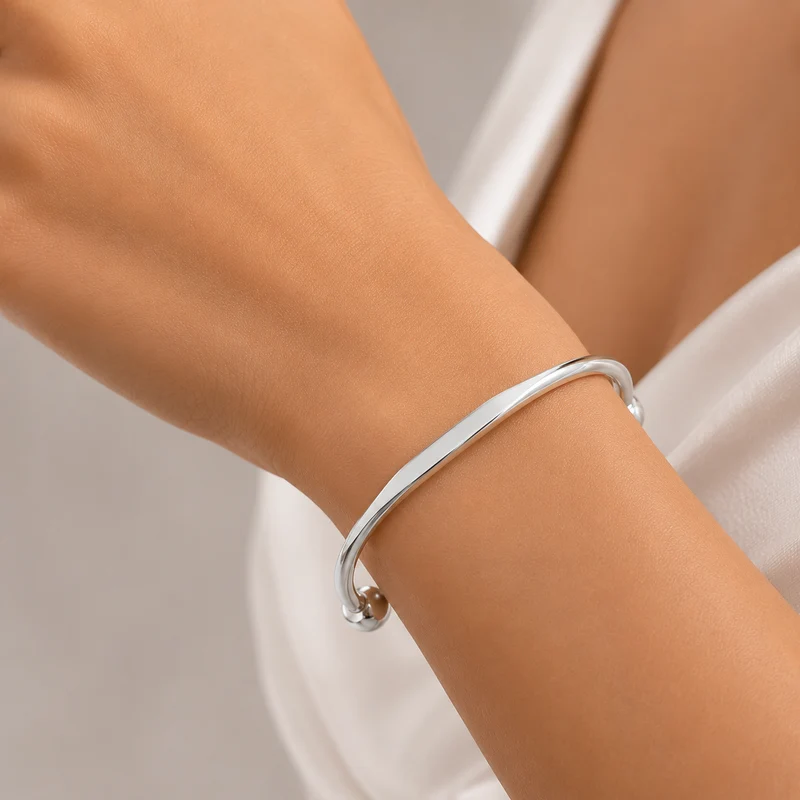 Solid Silver Faceted Torque Bangle