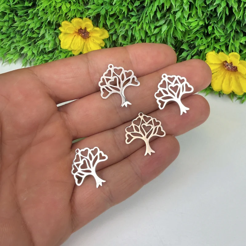 Anhänger aus Silber und Gold mit Lebensbaum und Herz