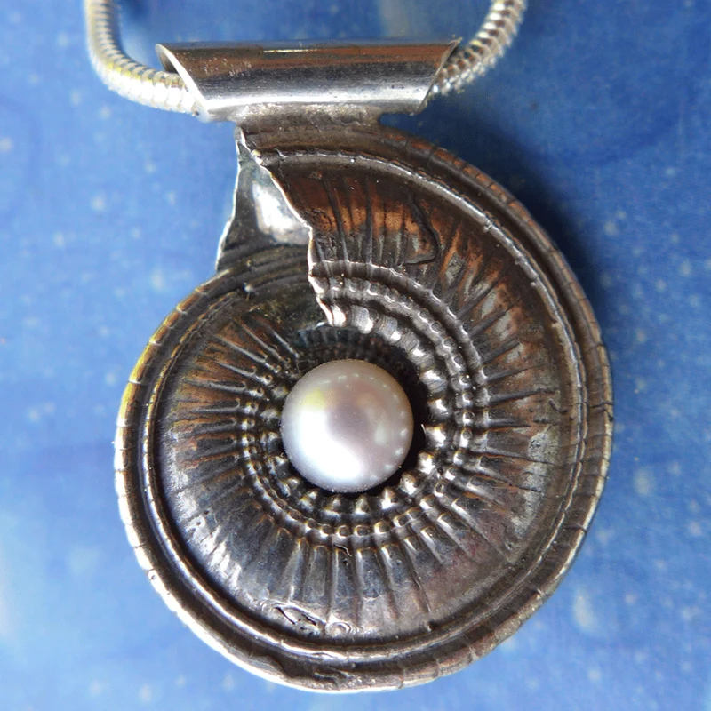 Perlenschmuck Schnecke Sonnenuhr