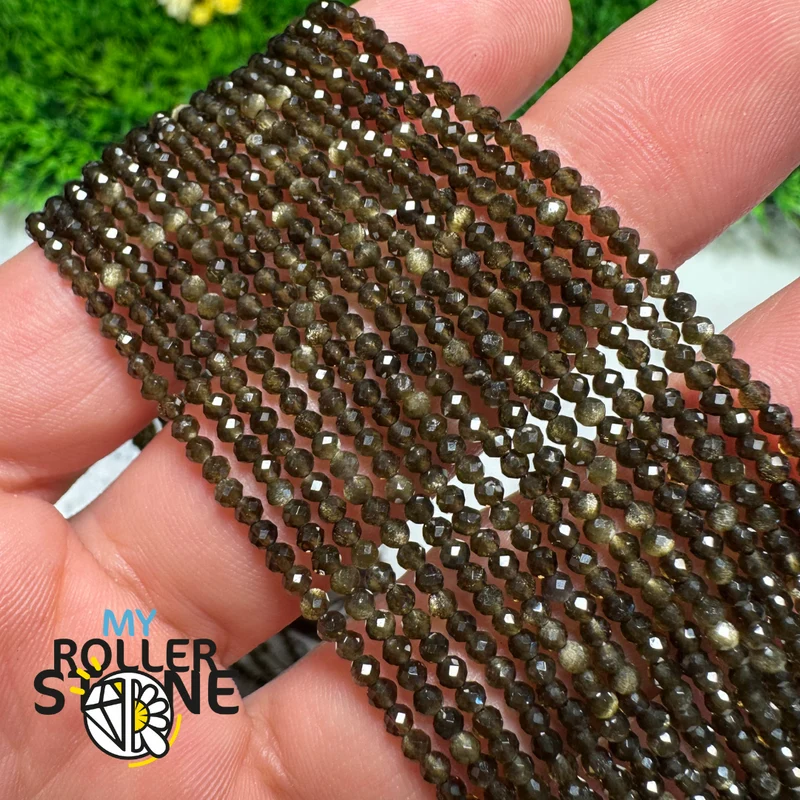 Facettierte goldene Obsidianperle