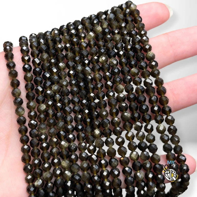 Facettierte goldene Obsidianperle